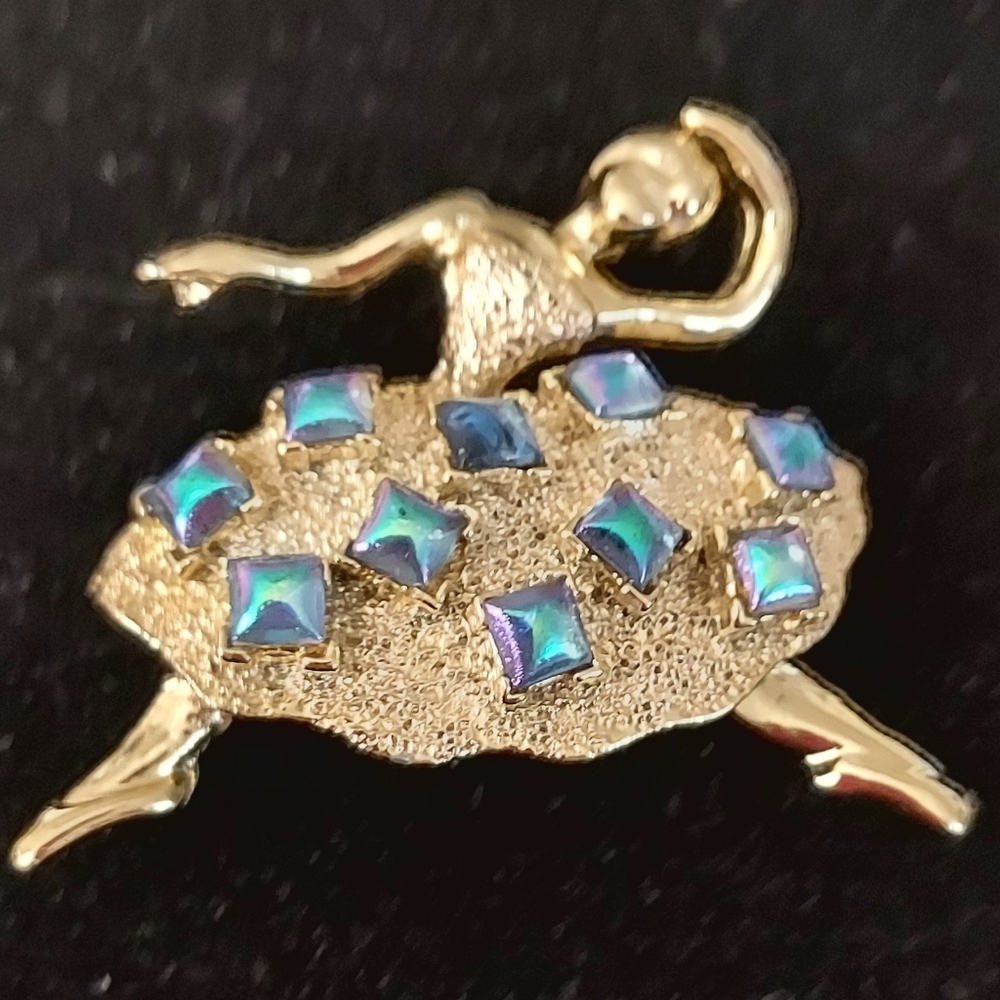 Elegant Gold Dancer Brooch with Blue Accents